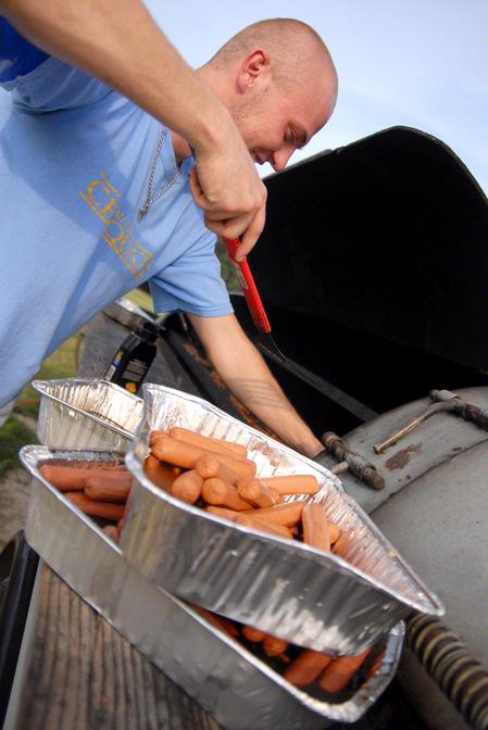 John Winfree, junior Christian Studies major, helps cook a meal for the IFC cookout.  This is one of the many events during Rush. 