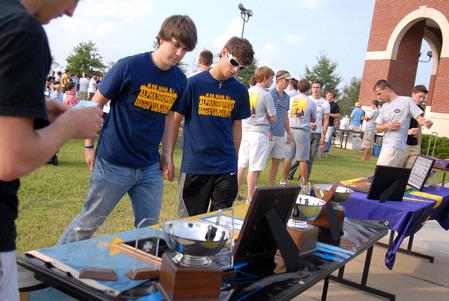 The men of ATO set up their table at the IFC cookout at the beginning of Rush.