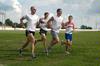 The men's track team runs during practice. - Photo by Sarah Palmer