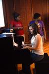 Megan Thompson, sophomore, goes over a new song for the MOSAIC Choir. - Photo by Kristi McMurry