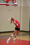 Katie Adams, senior public relations major, serves the ball to Lyon College.   - Photo by Kristi McMurry