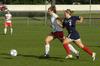 09/265/09 - Steffi King, freshman, outruns her Lyon College opponent for the ball. 