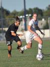 Sara Weir pushed the ball past a Union (Ky.) defender. - Photo by Tommy Sadler