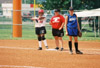 05/137/03 - Megan Quarry (20) of Decatur, Ala. and �鶹��Ƶ graduate assistant coach Jennifer Sabourin communicate at first base during the 2003 NAIA Softball World Series.