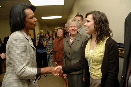 Former Secretary of State Condoleezza Rice greets Katie Shatzer, junior journalism major and <em>Cardinal & Cream</em> editor, outside the president's office before the 2009 Scholarship Banquet.
