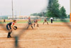 05/139/03 - The �鶹��Ƶ infield, made up of Jessica Kee at third, Amy Mejia at shortstop (not pictured), Crystal Surgalski at second, and Christina Johnson at first are ready as College Station, Texas native Leah Gronberg delivers a pitch during the 2003 NAIA Softball World Series in Decatur, Ala.