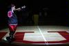 10/22/09 - Jessica Graves, senior, runs into the spotlight to greet the crowd at Bulldog Madness.