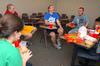 Rachel Dondaldson, junior ESL major, Thomas Shatzer, freshman, Paul Christensen, freshman youth ministry major, and John Winfree, junior Christian studies major, share a laugh during their weekly Life Group meeting. - Photo by Kristi McMurry