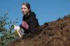 11/4/09 - Ashley Nabors, senior nursing major, participates in shoveling mulch around trees at Liberty Park during Campus and Community Day. - Beth Spain