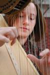 11/9/09 - Anna Wicker, junior music and Spanish major, plays the harp outside of Jennings Hall. - Beth Spain
