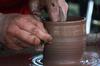 11/7/09 - Paige Ward, senior art major, creates pottery during Arts in the Park for Homecoming 2009. - Megan Bailey