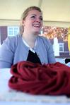 11/7/09 - Amanda Chambers, sophomore art major, sells her unique t-shirt wraps during Arts in the Park for Homecoming 2009. - Megan Bailey
