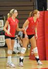 Katie Adams (left) and Anna Sims await the next serve. - Photo by Morris Abernathy