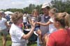 Associate Director of University Relations Bev Vos hands out Union stickers at a Jump 5 concert sponsored by Union in Franklin, Tenn. - Photo by Jim Veneman