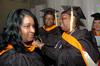 12/12/09 - MSN graduates Marisa Taylor assists Shelia Jordan with her gown as Sherri Serca (middle) looks on before Union's fall graduation ceremonies begin. - Beth Spain