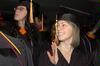12/12/09 - Hannah Brack, social work graduate, waves to family before fall graduation ceremonies begin at West Jackson Baptist Church. - Beth Spain
