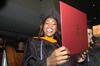 12/12/09 - Shawanda Motlow, MSN graduate, shows her diploma during fall graduation. - Beth Spain
