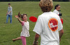 Sophomore Brad Spencer plays frisbee with a youngster at a Steven Curtis Chapman Brown Bag concert sponsored by Union in Franklin, Tenn.  - Photo by Jim Veneman