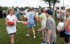 Sophomore Kathleen Lokey hands out Union frisbees at a Steven Curtis Chapman Brown Bag concert sponsored by Union in Franklin, Tenn.  - Photo by Jim Veneman