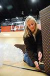 Sarah Chitwood, sophomore English major, unpacks furniture for the new Bowld Student Commons in preparation for the grand opening. - Photo by Morris Abernathy