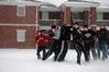 Blake Pennington and other Union students run a play during a game of football in the Water's quad Friday, Jan. 29. This was the first snow  of 2010 for Union. - Photo by Beth Spain