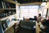 04/120/03 - Junior Bethany Davis reads in her bedroom. Union's residence life is unique in that all dorm rooms are apartment style so that each person has his or her own bedroom.