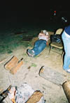 Brett Logan stays warm by the smoldering campfire while he sleeps at Cardboard City, an event sponsored by International Justice Mission to promote awareness and raise money for those experiencing injustice around the world.

 - Photo by Jonathan Blair