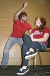 Chase Techentin, sophomore music major, participates in a comedy sketch involving audience member, Tiffany Wade, sophomore English major during Coffee and Comedy hosted by Junior Council. - Photo by Lauren Laster