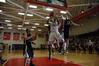 Senior Greg Truvillion goes up for a shot against Freed Hardeman University players during the TranSouth Tournament championship game. The Bulldogs came out as champions with a score of 75-65.  - Photo by Jordan Buie
