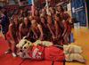 Union's cheerleaders take a break from cheering for the Lady Bulldogs to pose with Buster the Bulldog. The Lady Bulldogs defeated Southwestern Assemblies of God University in Game 1 of the NAIA Women's Basketball National Tournament. - Photo by Morris Abernathy