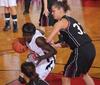 03/79/10 - Zeinab Chan, junior history major, dribbles around her Oklahoma Christian University opponent in the Quarterfinals game of the NAIA National Tournament. The Lady Bulldogs won 83-55.