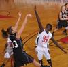 03/79/10 - Zeinab Chan, junior history major, jumps to block a shot by Oklahoma Christian University in the Quarterfinals game of the NAIA National Tournament. The Lady Bulldogs won 83-55.