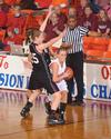 03/79/10 - Kayla Hudson, junior political science major, dribbles through her Oklahoma Christian University opponents in the Quarterfinals game of the NAIA National Tournament. The Lady Bulldogs won 83-55.
