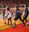 03/81/10 - Zeinab Chan, junior history major, dribbles around her Oklahoma City University opponent in the Semifinals of the NAIA National Tournament. The Lady Bulldogs advanced to the finals with a win of 63-61. 