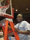 03/82/10 - Lavanda Ross, sophomore, cuts a piece of the net after the Lady Bulldogs defeated Azusa Pacific University to win the NAIA National Tournament. 