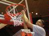 Ashley Lillard, senior, cuts a piece of the net after the Lady Bulldogs defeated Azusa Pacific University to win the NAIA National Tournament.  - Photo by Morris Abernathy