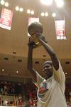 03/82/10 - Zeinab Chan, junior history major, celebrates and holds up her trophy after being named MVP of the NAIA National Tournament.