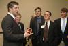 Tim Tebow jokes with several Union University students after the Roy L. White Legacy Golf and Gala, April 19. - Photo by Beth Spain
