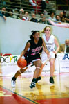 03/80/03 - 91������ senior forward, Tashekia Brown (23) drive the baseline in the 2003 NAIA National Tournament.