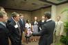 Tim Tebow, keynote speaker at the Roy L. White Legacy Golf and Gala, has a laugh with guests after the event. - Photo by Morris Abernathy