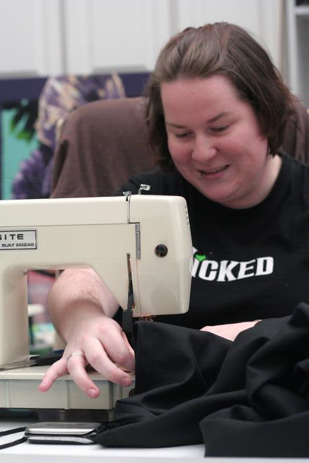 Mary Annis, senior digital media studies major, sews a dress in the art department.