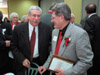 Professor of Education Bill Hedspeth (left) speaks with former Financial Aid Diretor Don Morris after receiving the Distinguished Faculty/Staff Award during Homecoming 2002.  - Photo by Jim Veneman