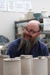 Lee Benson, professor of art and department chair, spends time in his students' studios. The art faculty invest a lot of their time in their students.  - Photo by Kristi McMurry