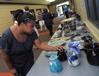 Carrie Myers, sophomore biology major, looks over some pottery at the annual Mother's Day Pottery and Art Sale where art students have an opportunity to sell their work.  - Photo by Morris Abernathy