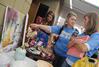 Students shop for mother's day gifts at the annual Mother's Day Pottery and Art Sale, where art students have the opportunity to sell their work. - Photo by Morris Abernathy