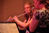 Robyn Kyzar, junior nursing major, and Kayleigh Hines, junior music major, play the flute and alto flute at a music recital in Hartley Hall - Photo by Ryan Oetting