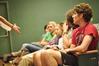 Cameron Puckett, sophomore media communications major, and fellow students listen to notes from their director in preparation for the theatre's student directed one acts. - Photo by Ryan Oetting