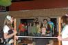 05/130/10 - Amanda Banks, junior nursing major, and Cheryl Propst, senior elementary education major, hold the limbo bar as Paul Fickes, sophomore nursing major, attempts to  limbo at the Residence Life Luau.