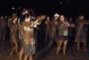 Students do the cha-cha in the mud at Midnight Mudness sponsored by Young Alums. - Photo by Abigail Harris