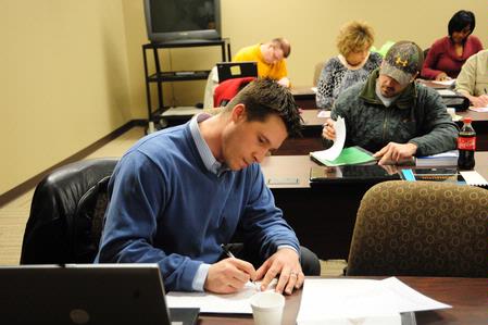 Students work diligently in a BSOL Degree Program class. 